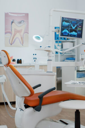 Interior of dentist stomatology orthodontic office with teeth radiography on monitor. Empty dental hospital room with nobody in it prepared for tooth diagnosis. Zoom in shot of medical workplace